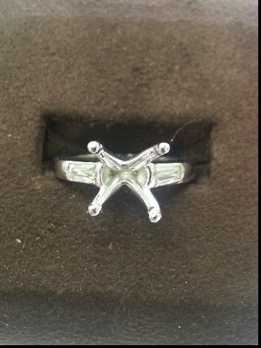 Three Stone Platinum Engagement Ring with Baguette Accents and 1.50 ct Total Diamond Weight