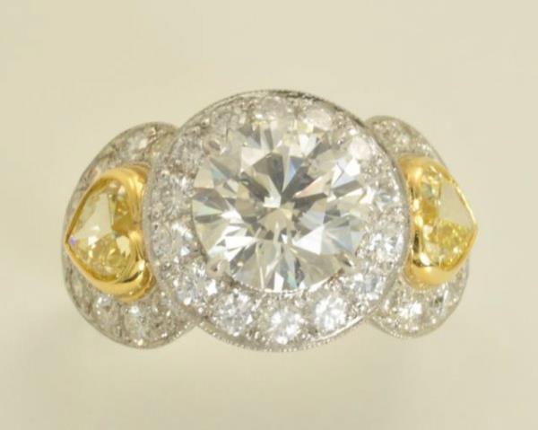 210-80-2235:  Diamond Ring  ||| Platinum & 18k; 1 Round diam = 3.23ct;  ||| 2 GIA Fancy  Yellow Heart shape = 1.64ct;    ||| 51 round diam = 2.14ct;  ||| $62;000.00 |||