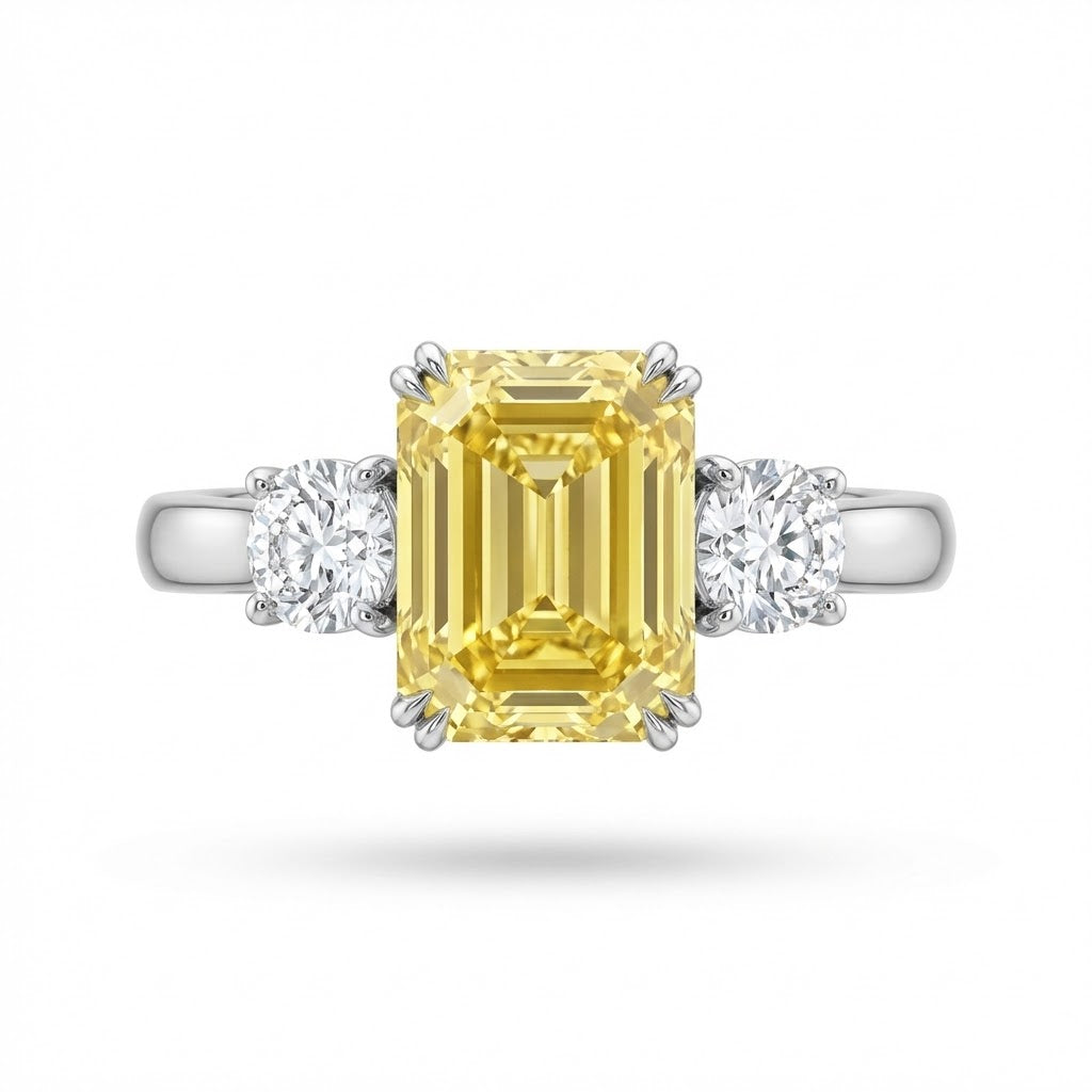 Emerald Cut 3.90 Carat Intense Yellow Diamond Ring in Platinum with 1.20 ct Side Diamonds